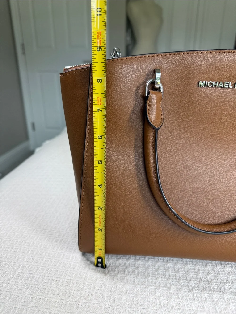 Michael Kors saddle tan saffiano leather satchel with silver hardware